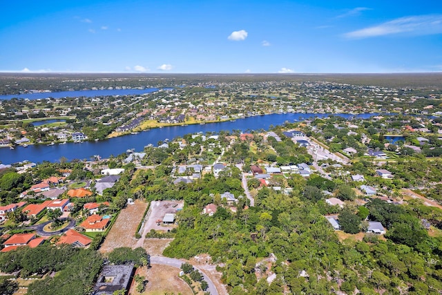 aerial view with a residential view and a water view