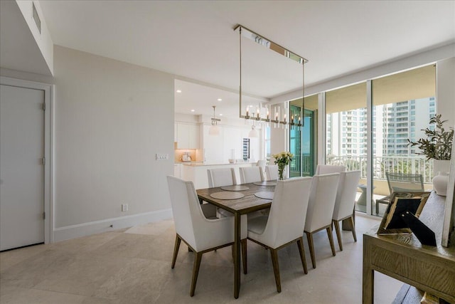 3720 S Ocean Blvd Unit 603, Highland Beach, FL 33487 - dining space featuring baseboards and a notable chandelier
