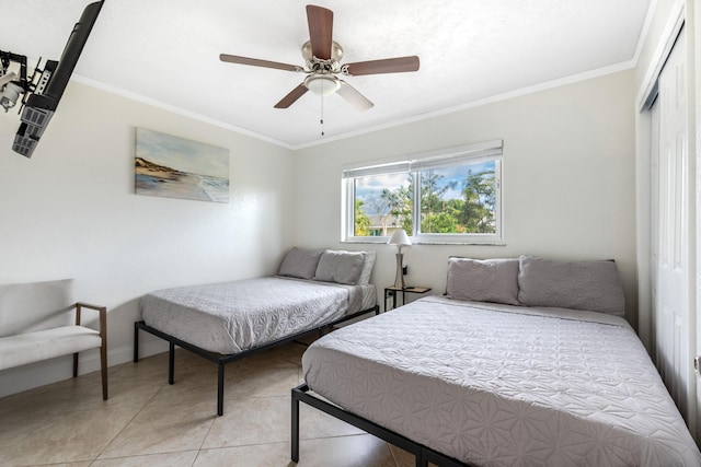 3338 NW 69th St, Fort Lauderdale, FL 33309 - bedroom with a ceiling fan, a closet, ornamental molding, and light tile patterned flooring