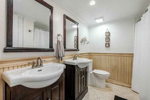 3338 NW 69th St, Fort Lauderdale, FL 33309 - bathroom with tile patterned flooring, ornamental molding, a wainscoted wall, and a sink
