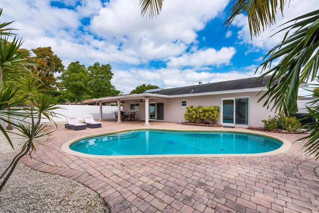 3338 NW 69th St, Fort Lauderdale, FL 33309 - view of pool featuring fence, a patio area, a fenced in pool, and a ceiling fan