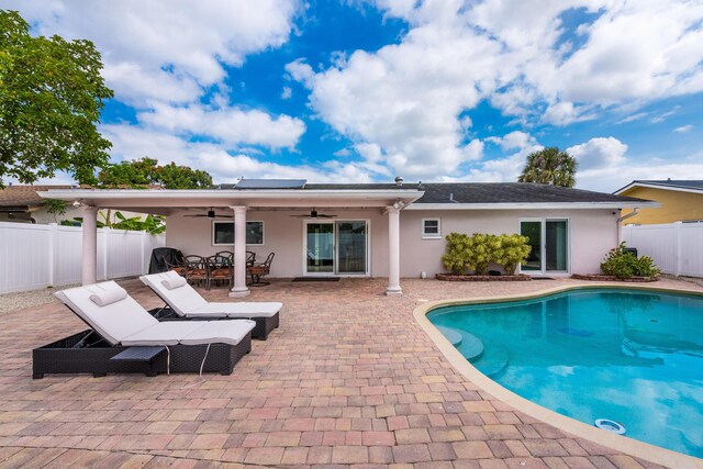 3338 NW 69th St, Fort Lauderdale, FL 33309 - view of swimming pool featuring a fenced in pool, a fenced backyard, outdoor dining space, ceiling fan, and a patio