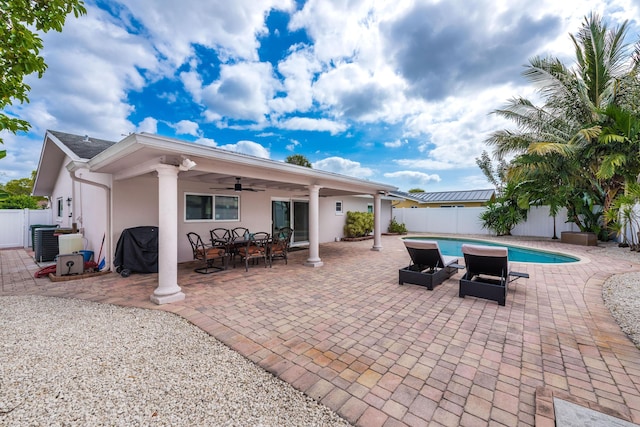 3338 NW 69th St, Fort Lauderdale, FL 33309 - view of swimming pool featuring central AC unit, a patio area, a fenced backyard, a fenced in pool, and ceiling fan