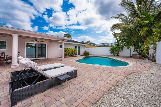3338 NW 69th St, Fort Lauderdale, FL 33309 - view of swimming pool with ceiling fan, a fenced backyard, a fenced in pool, and a patio area