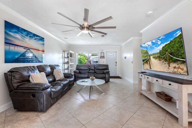 3338 NW 69th St, Fort Lauderdale, FL 33309 - living room featuring a textured ceiling, baseboards, ornamental molding, ceiling fan, and light tile patterned floors
