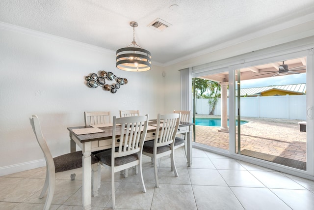 3338 NW 69th St, Fort Lauderdale, FL 33309 - dining space with ornate columns, visible vents, ornamental molding, baseboards, and a textured ceiling