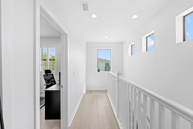 8781 Corvus Dr, Lake Worth, FL 33467 - hallway featuring baseboards, light wood-style floors, visible vents, and recessed lighting