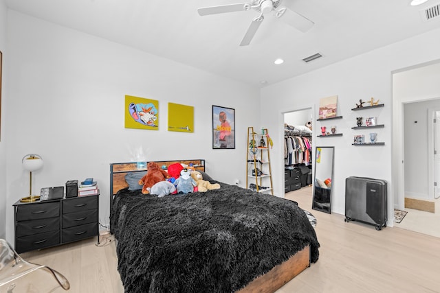 8781 Corvus Dr, Lake Worth, FL 33467 - bedroom featuring visible vents, a closet, light wood-style floors, and a walk in closet