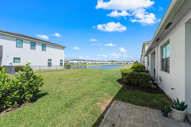 8781 Corvus Dr, Lake Worth, FL 33467 - view of yard featuring fence and a water view