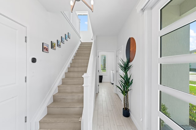 8781 Corvus Dr, Lake Worth, FL 33467 - stairway with baseboards and wood finished floors