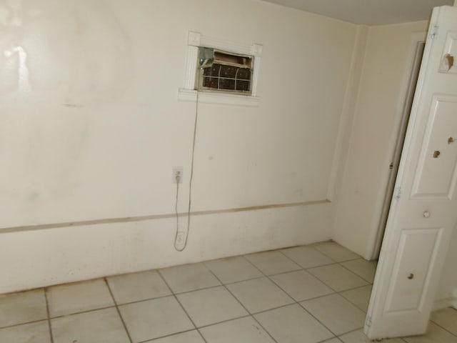 spare room with light tile patterned floors