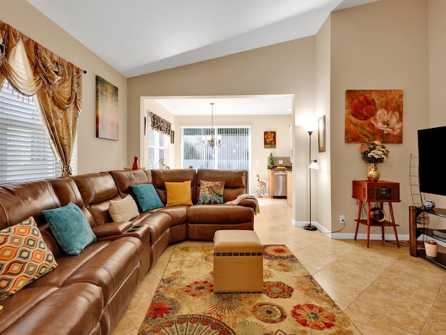 living room with light tile patterned floors, baseboards, high vaulted ceiling, and a chandelier