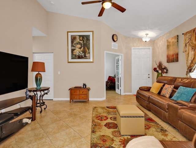 living room with a ceiling fan, visible vents, light tile patterned floors, baseboards, and lofted ceiling