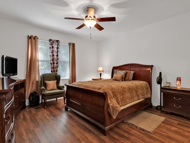bedroom featuring a ceiling fan and dark wood-style floors