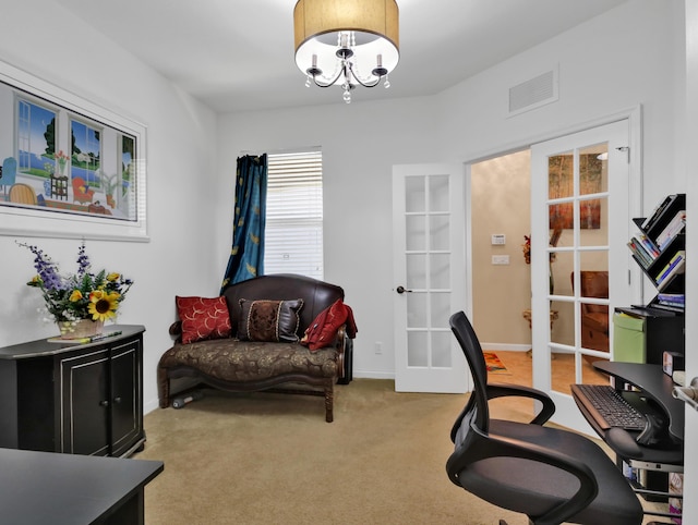 living area with light colored carpet, a notable chandelier, french doors, baseboards, and visible vents