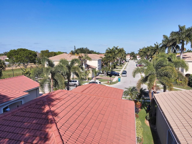 exterior space featuring a residential view and a tile roof