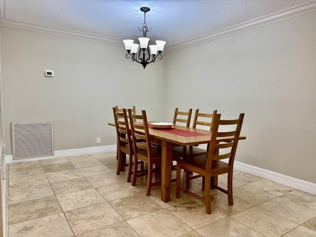 dining space with ornamental molding, a chandelier, a textured ceiling, baseboards, and light tile patterned floors