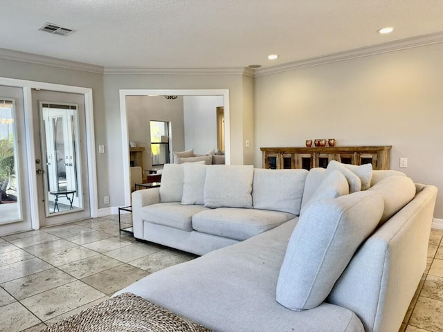 living room with crown molding, baseboards, and recessed lighting