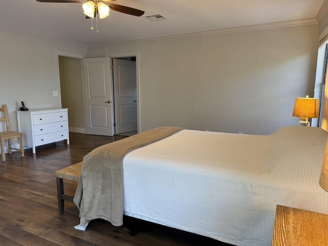 bedroom with dark wood-type flooring, ornamental molding, and ceiling fan