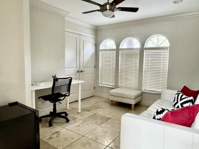 tiled office with ornamental molding, a ceiling fan, and baseboards
