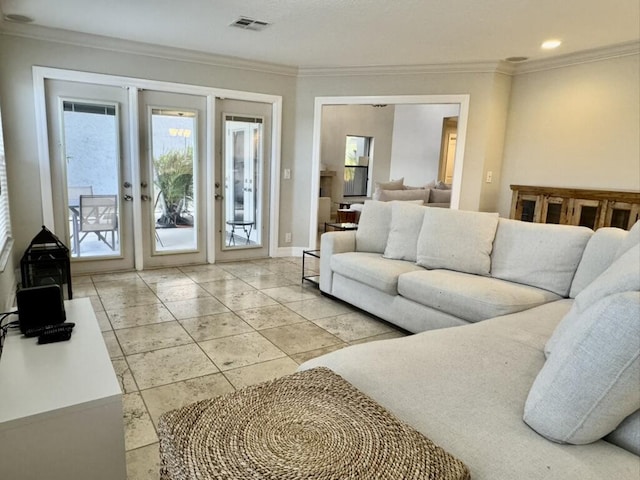 living area with ornamental molding, french doors, and baseboards