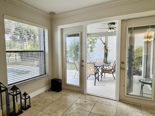 entryway featuring plenty of natural light, ornamental molding, baseboards, and french doors