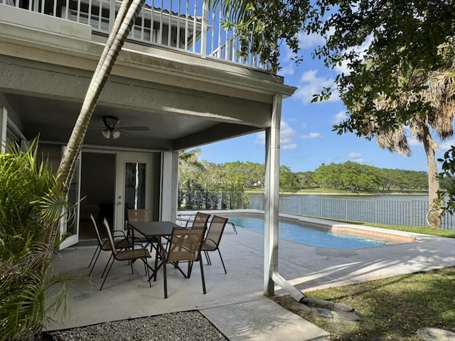 view of swimming pool featuring ceiling fan, a patio, a fenced backyard, and outdoor dining area