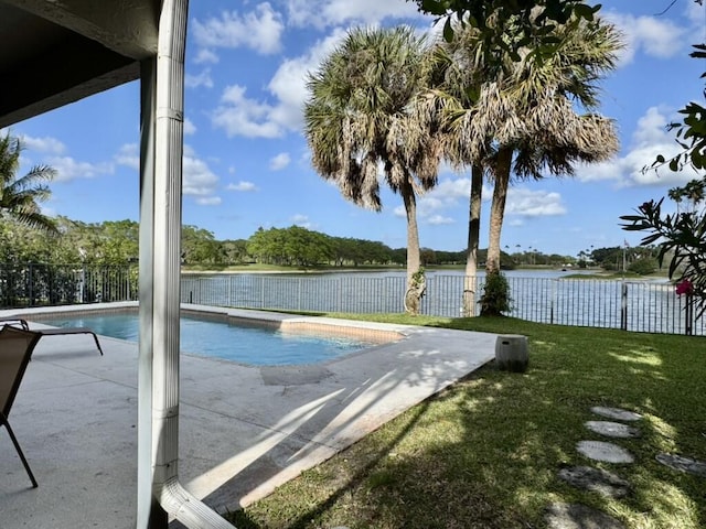 view of pool with a patio area and a water view