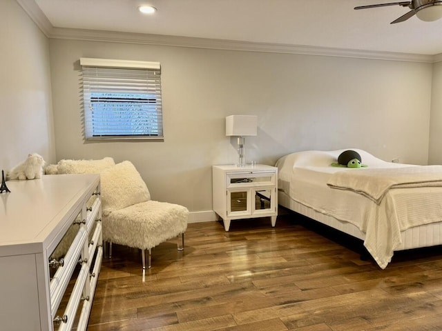 bedroom with crown molding, dark wood finished floors, recessed lighting, baseboards, and a ceiling fan