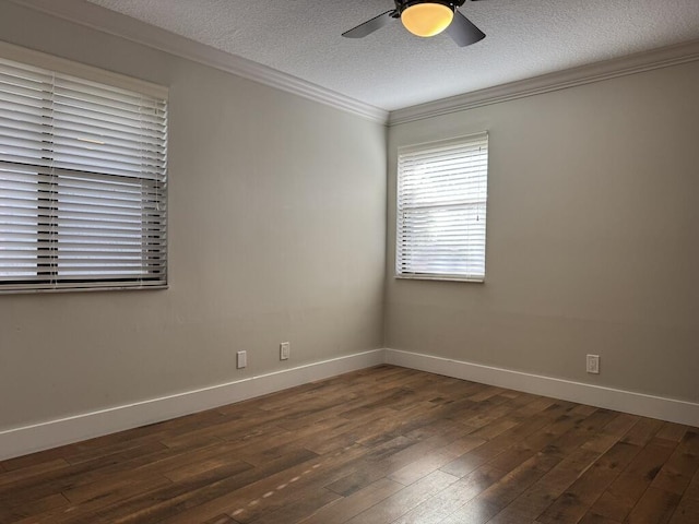 spare room featuring ornamental molding, a textured ceiling, dark wood finished floors, baseboards, and ceiling fan