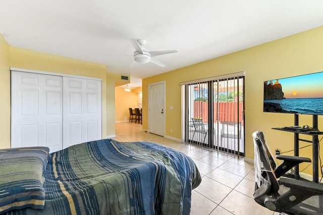 bedroom with access to exterior, light tile patterned flooring, visible vents, baseboards, and a closet