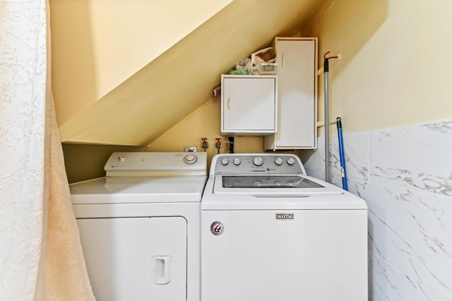 laundry area featuring washer and clothes dryer and laundry area