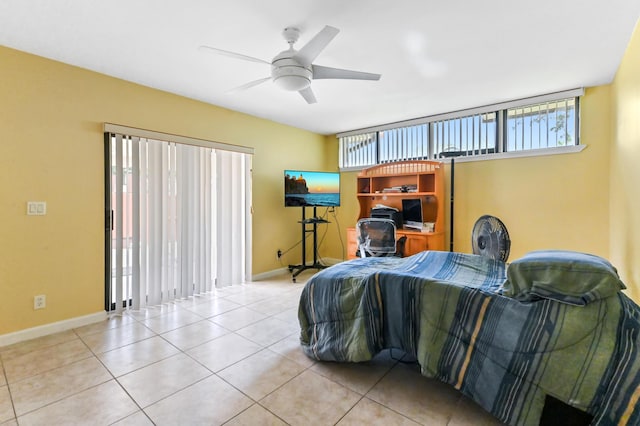 bedroom featuring baseboards, a ceiling fan, and tile patterned floors