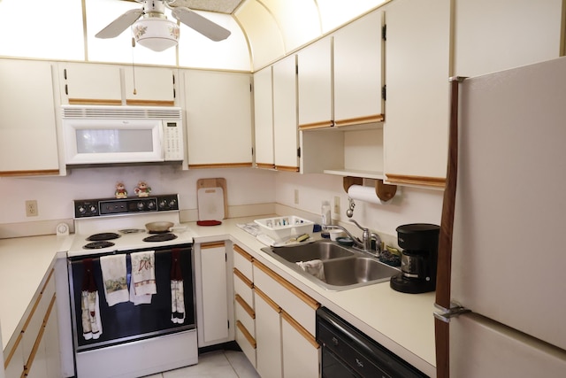 3302 SE Guinevere Ln, Port Saint Lucie, FL 34952 - kitchen featuring a ceiling fan, light tile patterned floors, white appliances, a sink, and light countertops