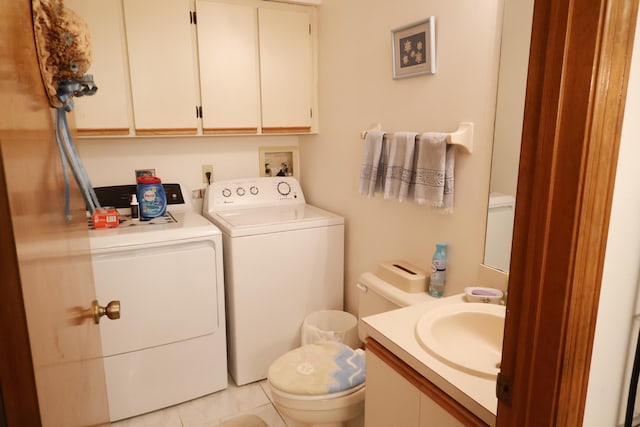 3302 SE Guinevere Ln, Port Saint Lucie, FL 34952 - bathroom with tile patterned floors, washing machine and dryer, toilet, and vanity