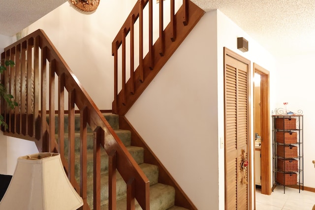 3302 SE Guinevere Ln, Port Saint Lucie, FL 34952 - stairway with tile patterned flooring and a textured ceiling