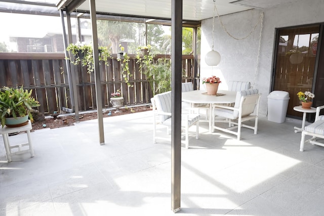 3302 SE Guinevere Ln, Port Saint Lucie, FL 34952 - sunroom featuring outdoor dining space