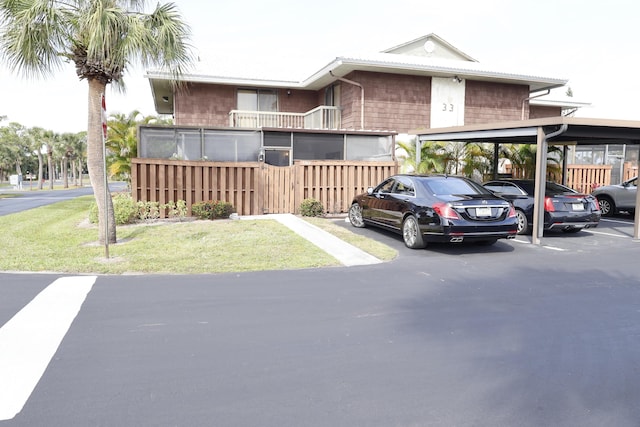 3302 SE Guinevere Ln, Port Saint Lucie, FL 34952 - partially covered parking lot with fence
