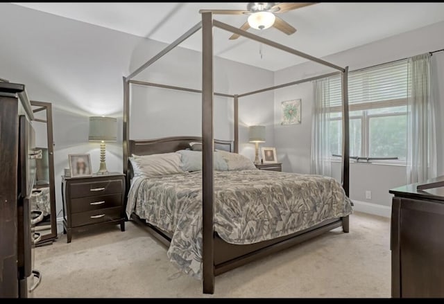 5959 SE Crooked Oak Ave, Hobe Sound, FL 33455 - carpeted bedroom featuring baseboards and ceiling fan