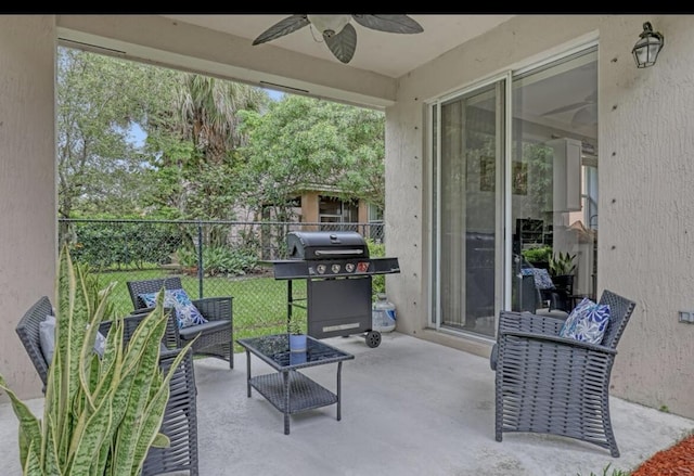 5959 SE Crooked Oak Ave, Hobe Sound, FL 33455 - view of patio / terrace featuring fence, a ceiling fan, a grill, and an outdoor living space