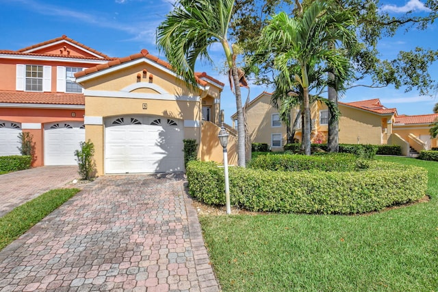 17051 Emile St Unit 5, Boca Raton, FL 33487 - multi unit property featuring stucco siding, a garage, a tiled roof, and decorative driveway