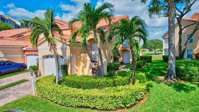 17051 Emile St Unit 5, Boca Raton, FL 33487 - exterior space with a tile roof, decorative driveway, a front lawn, a garage, and stucco siding