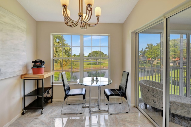 17051 Emile St Unit 5, Boca Raton, FL 33487 - dining area with an inviting chandelier, a water view, and baseboards