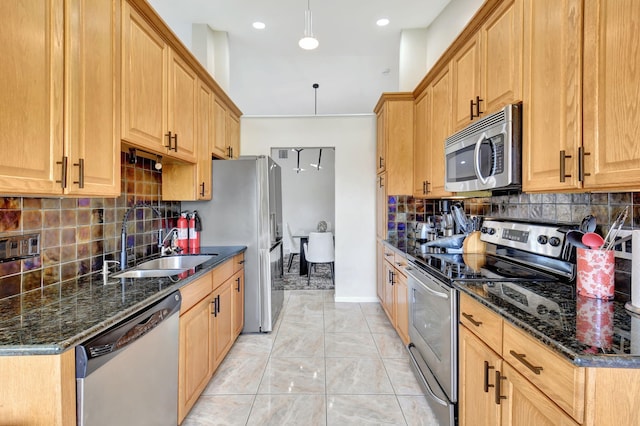 17051 Emile St Unit 5, Boca Raton, FL 33487 - kitchen featuring backsplash, appliances with stainless steel finishes, and a sink
