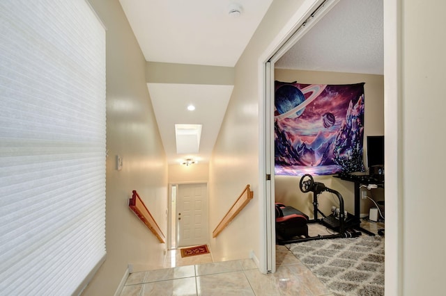 17051 Emile St Unit 5, Boca Raton, FL 33487 - hallway featuring tile patterned floors and an upstairs landing