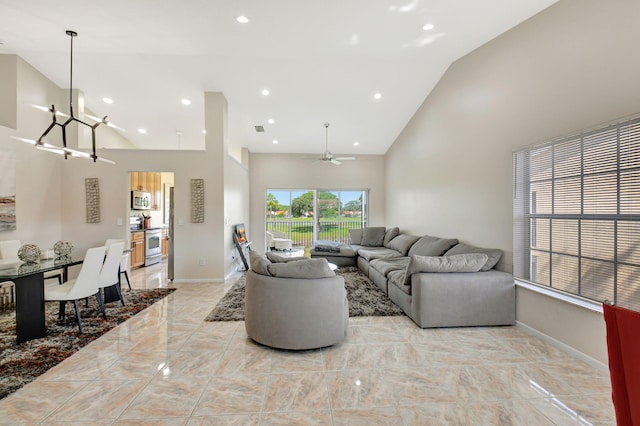 17051 Emile St Unit 5, Boca Raton, FL 33487 - living room featuring high vaulted ceiling, ceiling fan with notable chandelier, marble finish floor, baseboards, and recessed lighting