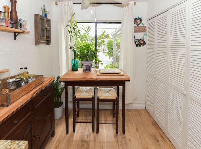 dining space featuring light wood-style flooring