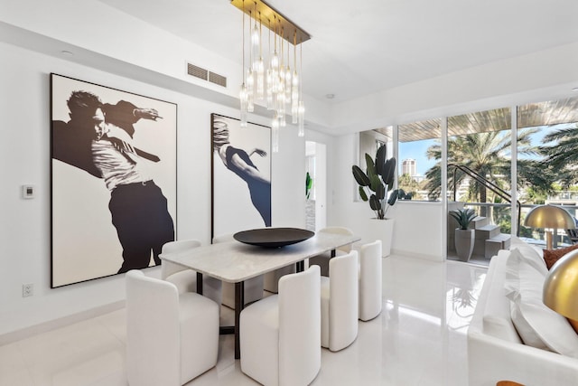 dining room featuring visible vents, light tile patterned floors, and an inviting chandelier