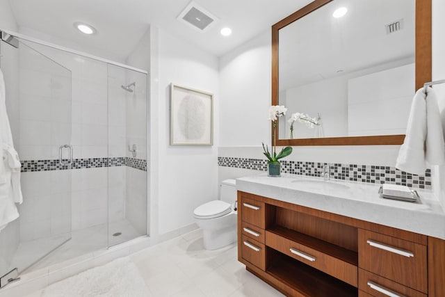bathroom featuring visible vents, toilet, a stall shower, and tile patterned floors