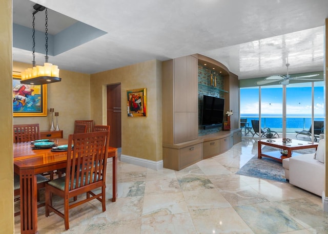1600 S Ocean Blvd Unit Mph02, Lauderdale By The Sea, FL 33062 - dining area featuring ceiling fan, baseboards, and floor to ceiling windows